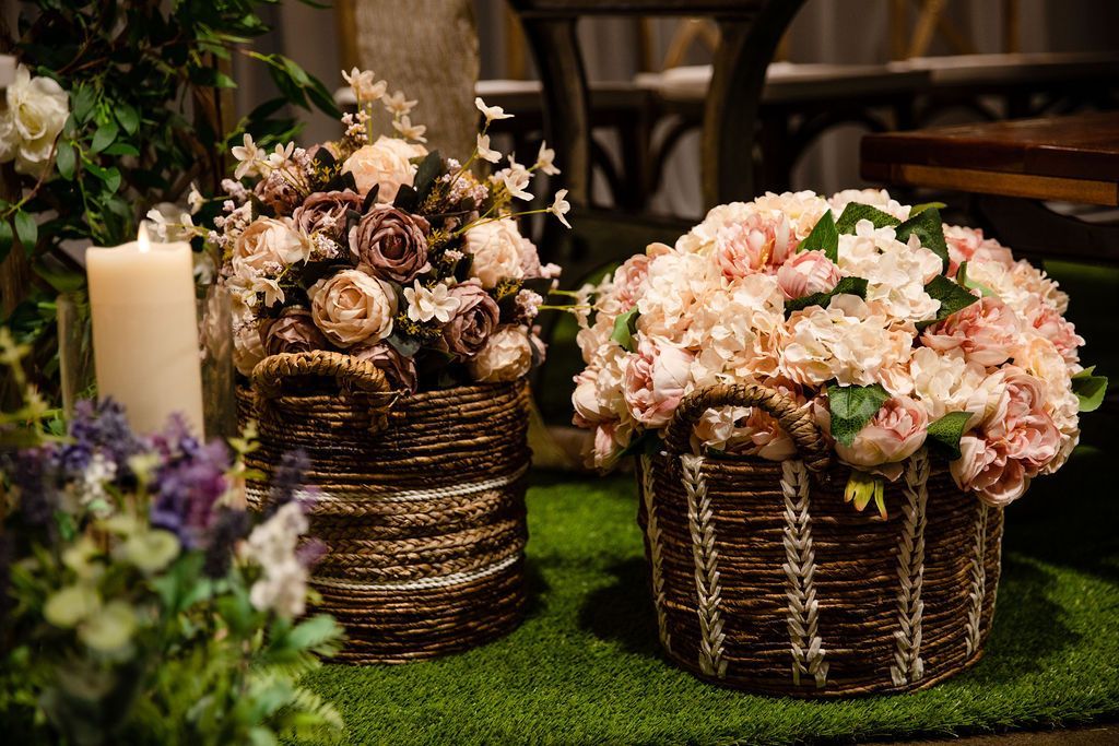 wicker baskets of roses and hydrangeas in mauve and blush