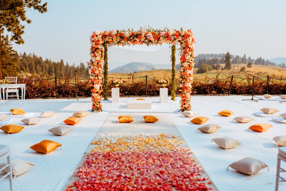 Bright orange and pink outdoor sikh wedding in the country