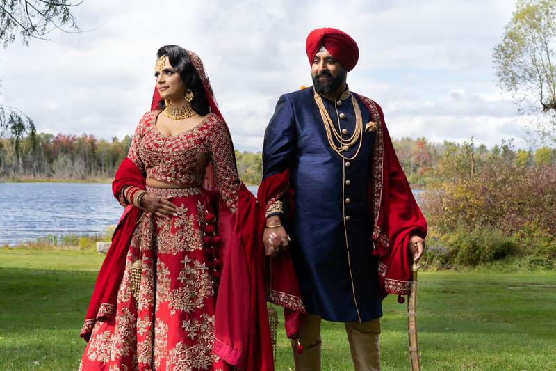 Newlywed Sikh couple post by the lake at Royal Ambassador Event Centre