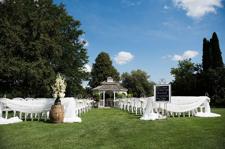 Outdoor wedding ceremony in a gazebo at the Caledon Golf and Country Club